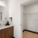 well lit bathroom with walk-in closet