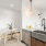 large sink in bright kitchen adjacent to dining area