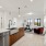 open kitchen flows into living room with large windows