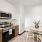 well lit dining area beside kitchen