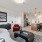 well lit living room open to kitchen